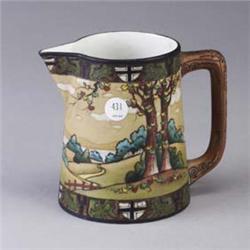 NIPPON porcelain pitcher painted with country landscape. Stmaped mark. Minor losses to enamel. 5 1/2