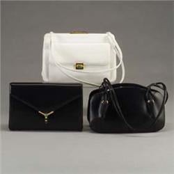 Three JUDITH LEIBER purses: a black leather envelope clutch-bag with jade cabochon clasp, a bone lea