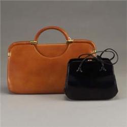 Two JUDITH LEIBER purses: a saddle-brown envelope purse with leather-covered semi-circular handles a