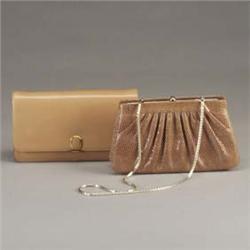 Two JUDITH LEIBER clutch purses: one in tan leather with envelope flap and gold-filled clasp, and on
