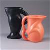 Image 1 : Two contemporary pitchers, one in a bright orange glaze, the other by "Stella" in black. Both marked