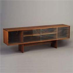 Rosewood credenza with two sliding glass doors, and interior shelf. Minor chips to edges of glass. U