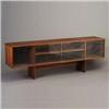 Image 1 : Rosewood credenza with two sliding glass doors, and interior shelf. Minor chips to edges of glass. U