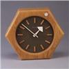 Image 1 : HOWARD MILLER contemporary clock with oak frame and markers. Minor split to wooden casing. Metal HOW
