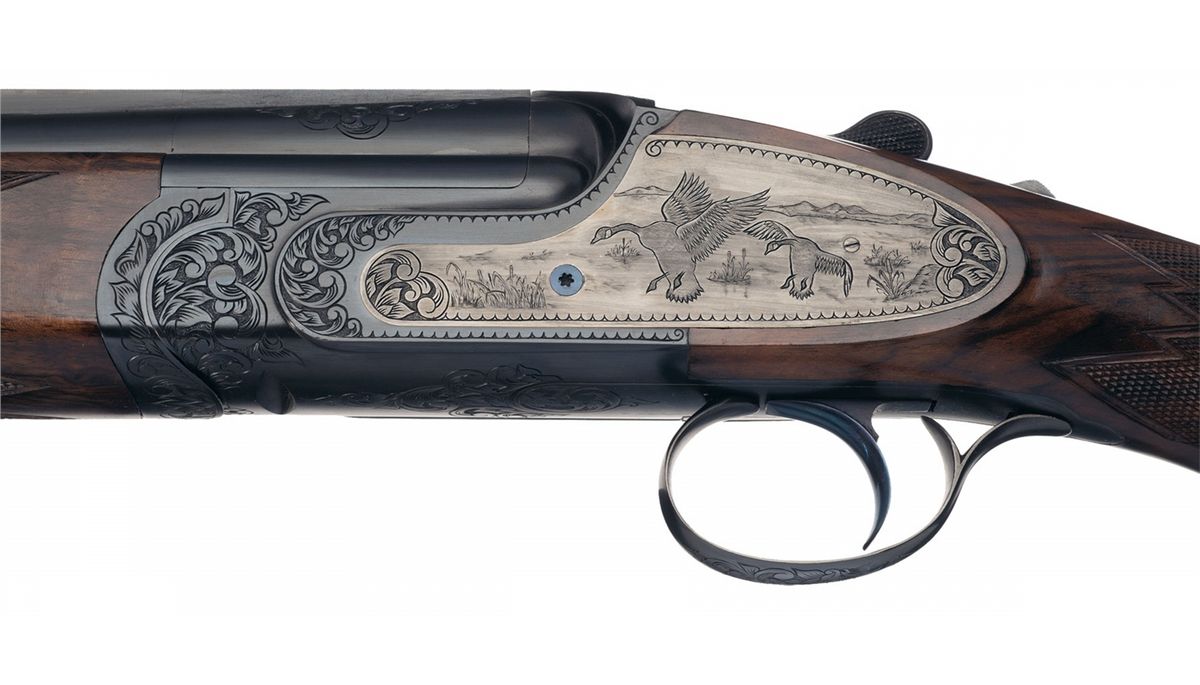Engraved Sabatti Over/Under Shotgun with Leather Case and Accessories