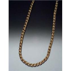 Tested 14-Karat Yellow Gold Polished and Textured Twin Ring-Link Vest Chain Circa 1930 The small...