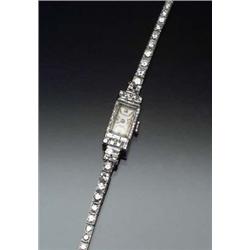 Swiss Platinum and Diamond Self-Winding Cocktail Watch, Emewo Circa 1957 The case and lugs set wi...