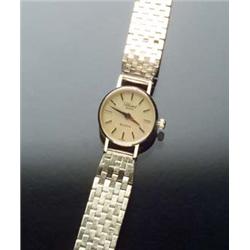 Lady's Swiss 14-Karat Yellow Gold Quartz Wristwatch, Bulova, ULTIME Circa 1980 Diameter: 19 mm Le...