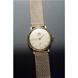 Gentleman's Swiss 14- and 18-Karat Yellow Gold Self-Winding Wristwatch, Movado Circa 1950 The cas...