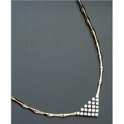 14-Karat Yellow and White Gold 'V' Necklace Set with a pavé of twenty-one round brilliant cut dia...