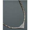 Image 1 : 14-Karat Yellow and White Gold 'V' Necklace Set with a pavé of twenty-one round brilliant cut dia...