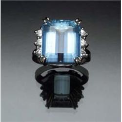 Retro Platinum, Aquamarine and Diamond Dinner Ring Circa 1940 Set with one rectangular emerald cu...