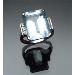 Retro Platinum, Aquamarine and Diamond Dinner Ring Circa 1940 Set with one rectangular emerald cu...