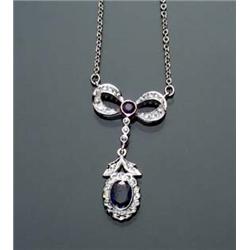 14-Karat White Gold, Blue Sapphire and Diamond Necklace Set with one oval and one round faceted d...