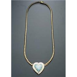 18-Karat Yellow Gold, White Opal and Diamond Necklace Set with a cabochon heart shape white opal...
