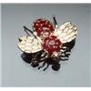 Image 1 : 14-Karat Yellow Gold and Ruby Bee Brooch Set with a cluster of twenty round faceted rubies weighi...