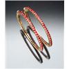 Image 1 : Pair of Indian 22-Karat Yellow Gold and Ruby Bangle Bracelets Each set with sixty-five round face...