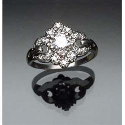 Platinum and Diamond Dinner Ring Set with one round brilliant cut diamond weighing approximately...