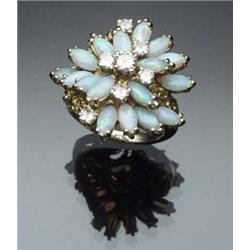 14-Karat Yellow Gold, White Opal and Diamond Dinner Ring Set with seventeen marquis cabochon opal...