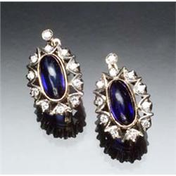 Pair of Russian 14-Karat Rose and White Gold, Blue Sapphire and Diamond Earrings Each set with a...