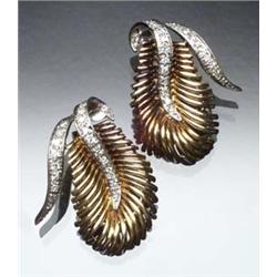 Pair of 18-Karat Yellow and White Gold Clip-Back Earrings Each set with twenty-two graduated sing...