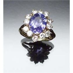 18-Karat Yellow Gold, Blue Sapphire and Diamond Dinner Ring Set with a cushion cut sapphire weigh...