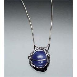 Platinum and Blue Star Sapphire Bead Pendant and 14-Karat White Gold Chain The enclosed platinum...
