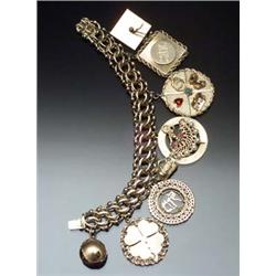 14-Karat Yellow Gold Eight-Charm Bracelet Circa 1950 Length: 7-1/2 in (19.1 cm) Gross weight: 74....