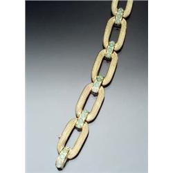 Tested 18-Karat Yellow Gold and Jade Bracelet The alternating links and clasp set with twenty rou...