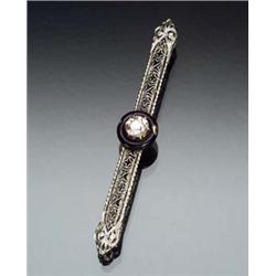 Art Deco Filigree White Gold, Diamond and Black Enamel Bar Pin Circa 1920-1930 Set with one old m...