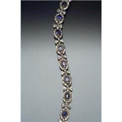 18-Karat Yellow Gold, Blue Sapphire and Diamond Cocktail Bracelet Set with twelve oval faceted bl...