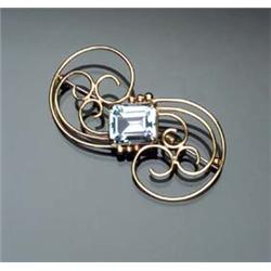 14-Karat Yellow Gold and Aquamarine Brooch Circa 1950 Set with one large rectangular cut aquamari...