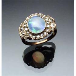 Antique Tested 14-Karat Yellow Gold, White Opal and Diamond Dinner Ring Circa 1900 Set with one o...