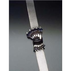 Retro Platinum, Sapphire and Diamond Bracelet Circa 1940 Set with six oval and six round faceted...