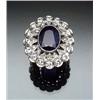 Image 1 : Edwardian Platinum, Blue Sapphire and Diamond Cocktail Ring Circa 1910 Set with an oval faceted s...