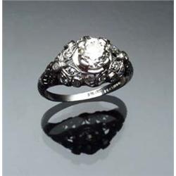 Art Deco Platinum and Solitaire Diamond Ring Circa 1920-1930 Set with one round old European cut...