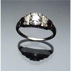 Art Deco 18-Karat White Gold and Solitaire Diamond Ring Circa 1920-1930 Set with one old mine cut...