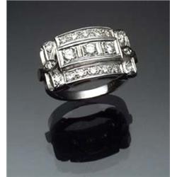 Art Deco 14-Karat White Gold and Diamond Dinner Ring Circa 1935 Set with three round brilliant an...