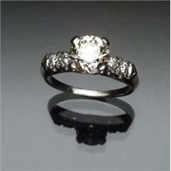 Platinum and Solitaire Diamond Ring Set with one round old European cut diamond weighing approxim...