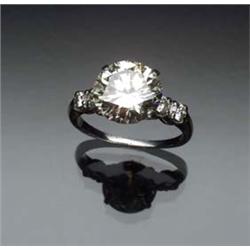 Platinum and Solitaire Diamond Ring Set with one round old European cut diamond weighing approxim...