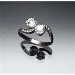 Antique Platinum Twin Diamond Bypass Dinner Ring Circa 1900 Set with two old mine cut diamonds ea...