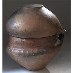 Vases. Villanovan impasto-ware biconical urn with lid. Circa 8th century BC.  D/ Of burnished black 