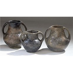 Vases. Three Villanovan impasto amphorae. Circa 8th - 7th century BC.  D/ 8.5, 10 and 11 cm high.   