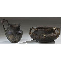 Vases. Two Etruscan vessels. Circa 7th century BC.  D/ Bucchero-ware kyathos. 7.5 cm high. Repaired.