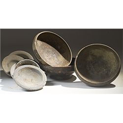 Vases. Nine bucchero-ware vessels. Circa 6th century BC.  D/ Six burnished black bucchero-ware sauce