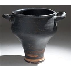 Vases. Campanian black-glazed skyphos. Circa 4th century BC.  D/ Twin loop handles, with a ring foot