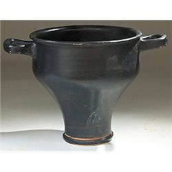 Vases. Campanian black-glazed skyphos. Circa 4th century BC.  D/ Twin loop handles. 18.5 cm high.   