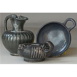 Vases. Three balck-glazed vessels. Circa 4th century BC.  D/ Apulian miniature black-glazed oinochoe