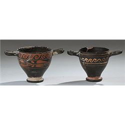 Vases. Two Apulian xenon-ware miniature skyphoi. Circa 4th century BC.  D/ Black-glazed with decorat