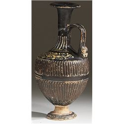 Vases. Apulian black-glaze Gnathian ware lekythos. Circa 4th century BC.  D/ The ribbed body with fl